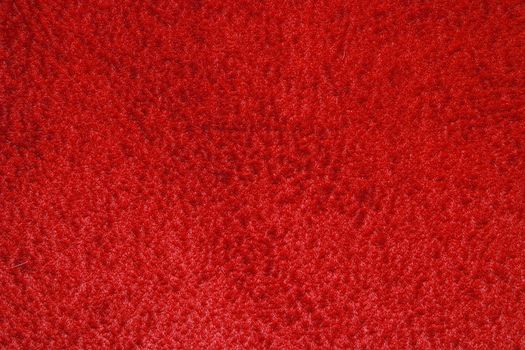 texture of carpet coverage of red color with a shallow nap