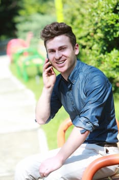 Russian red hair man in park with telephone