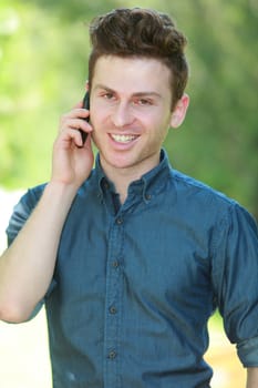 Portrait of young red hair man with telephone