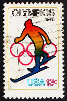 UNITED STATES OF AMERICA - CIRCA 1976: a stamp printed in the USA shows Skiing and Olympic Rings, 12th Winter Olympic Games, Innsbruck, Austria, circa 1976