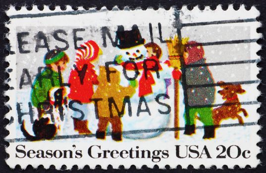 UNITED STATES OF AMERICA - CIRCA 1982: a stamp printed in the USA shows Children Playing in the Snow, Christmas, circa 1982