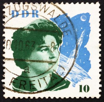 GDR - CIRCA 1963: a stamp printed in GDR shows Valentina Tereshkova and Space Craft, the First Woman in Space, circa 1963
