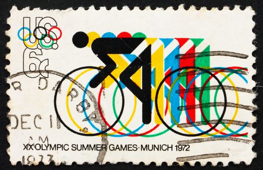 UNITED STATES OF AMERICA - CIRCA 1972: a stamp printed in the USA shows Bicycling and Olympic Rings, 20th Summer Olympic Games, Munich, Germany, circa 1972