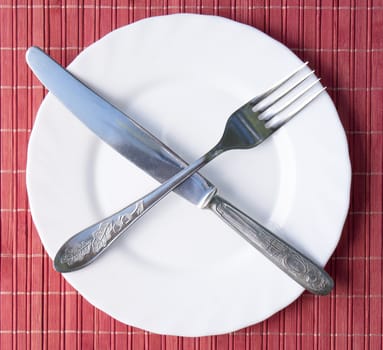 Table lunch devices against an abstract structure from a natural bamboo