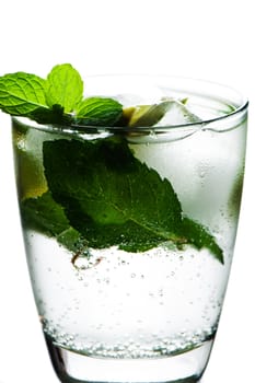 Closeup of soda water with limes and mint on White background