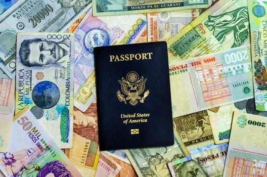 American passport with various Latin American currencies