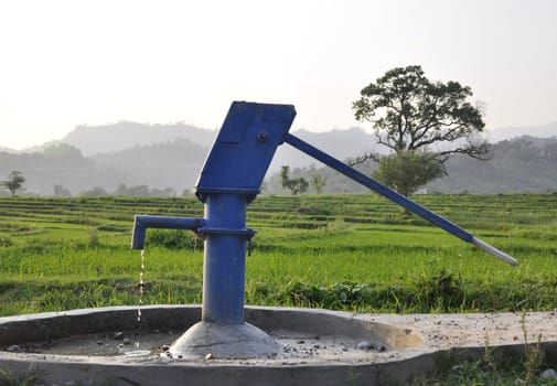 A Blue Water Pump in the Countryside in India