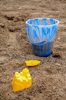 a child's beach toys on the sand