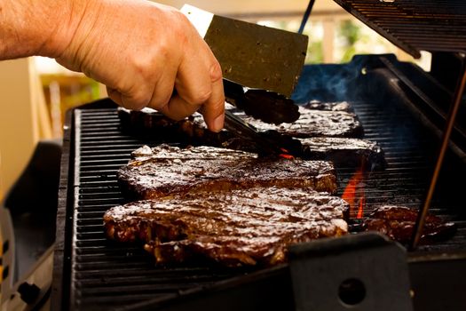 delicious steaks on the barbeque