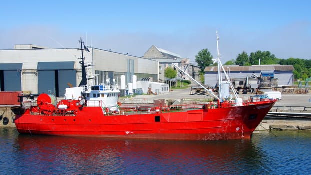 The fishing vessel costs at a mooring