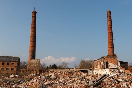 abandoned factory with two smokestacks
