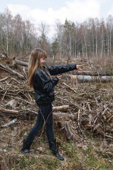 Girl playing Geocaching real-world outdoor treasure hunting game.