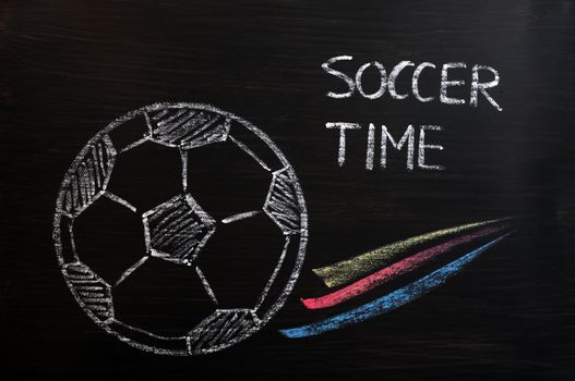 Chalk drawing of Football or soccer time on a wooden blackboard