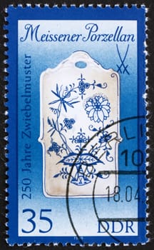 GDR - CIRCA 1989: a stamp printed in GDR shows Breadboard, 250th Anniversary of Meissen Onion-pattern Porcelain and Sword Emblem, circa 1989