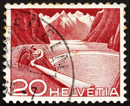SWITZERLAND - CIRCA 1949: a stamp printed in the Switzerland shows Reservoir, Grimsel, Switzerland, circa 1949