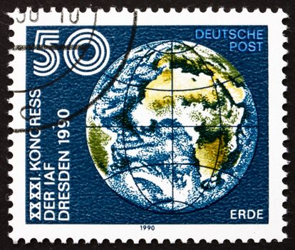 GDR - CIRCA 1990: a stamp printed in GDR shows Earth Globe, 41st Congress of International Astronautics Federation, Dresden, circa 1990
