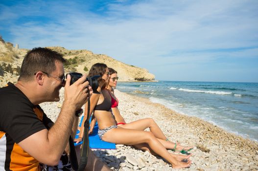 Wide angle lens letting the guy shoot the girls unnoticed