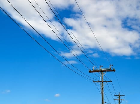 electricity power lines in australia with blue sky background