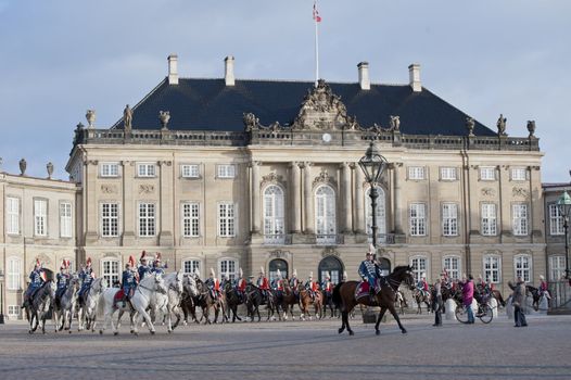 The Royal Danish Guard patrols the royal residence Amalienborg Palace and serves the royal Danish family.  Amalienborg is also known for the Danish Royal Guard, who patrol the palace grounds. The Danish Royal Guard march from Rosenborg Castle at 11.30am daily through the streets of Copenhagen, and execute the changing of the guard in front of Amalienborg Palace at noon. When the Queen is in residence the guard is accompanied by the Royal Guards music band. 