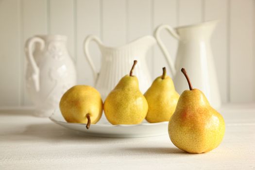 Fresh ripe pears on wooden table
