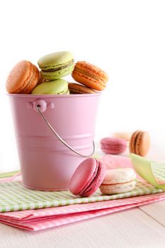 Delicious French Macaroons  in pail on table