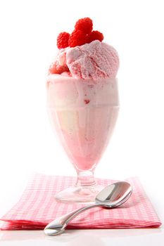 Big raspberry sundae with napkin on white 