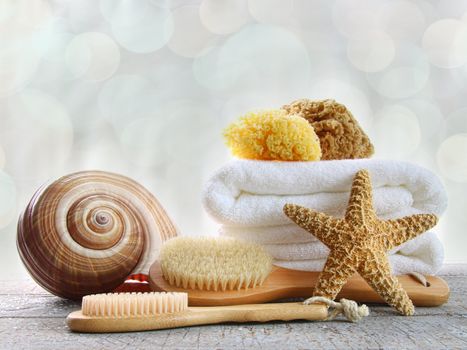 Assortment of spa brushes and sponges  on wood surface