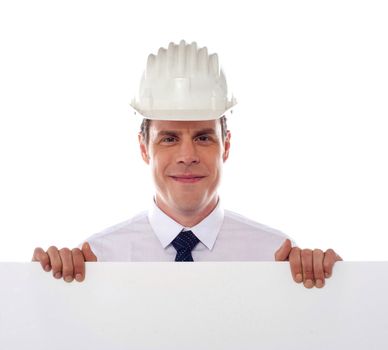 An architect holding blank white placard. All on white background