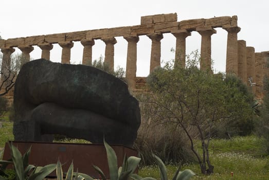 Statue and ruins in "Valle dei Templi"-  Valley of the temples, Agrigento, Sicily, Italy