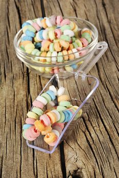 Candy on strings on wooden background