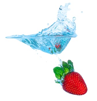 Fresh Strawberry Dropped into Water with Splash on white backgrounds