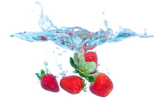 Fresh Strawberry Dropped into Water with Splash on white backgrounds