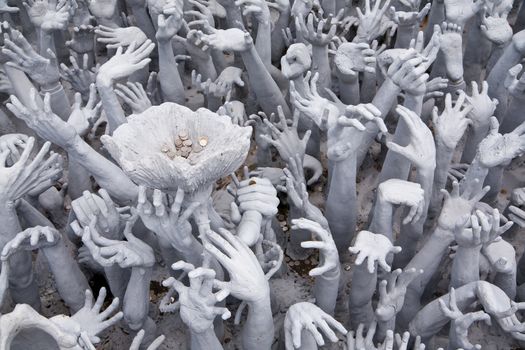 Art sculpture of stories about the dead. Wat Rong Khun in architecture. Chiang Rai, Thailand