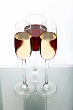 Glasses with wine on the color background