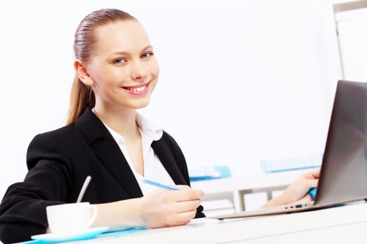 Business woman working on computer in office