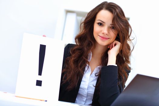 Young pretty business woman with notebook in the office