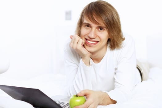 Portrait of a young man with notebook