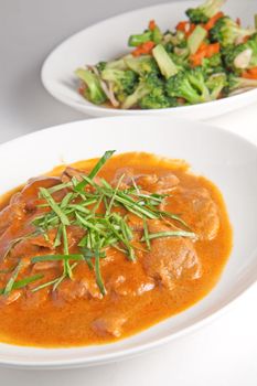 Curry chicken with vegetables, fried broccoli