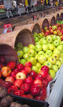 A photograph of various apples for sale in a grocery store.