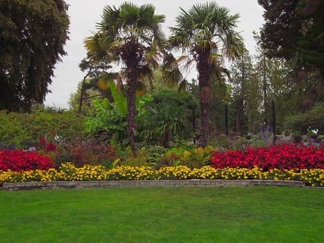 A photograph of a flower garden located at a public park.