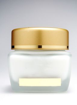 Cosmetics cream bottle with a white background.
