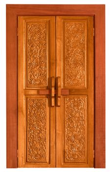 An old wooden door covered with carvings