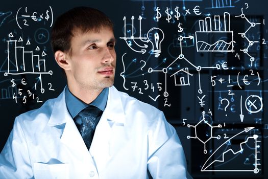 Young scientist in laboratory in white uniform