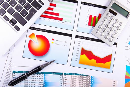 Financial paper charts and graphs on the table