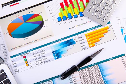 Financial paper charts and graphs on the table