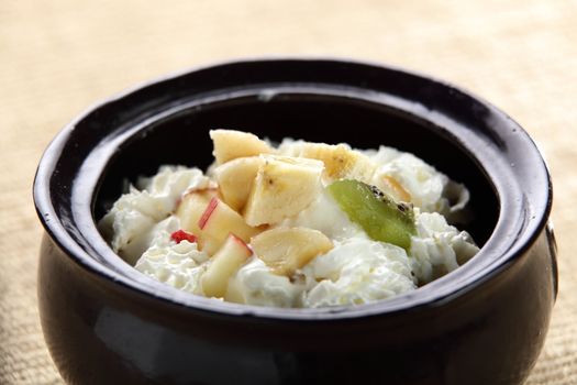 fresh icecream with fruits in black pan