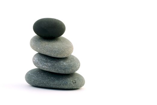 4 zen stones on white background