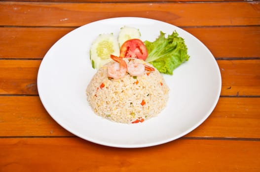 Fried rice with shrimp on wood