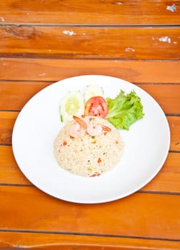 Fried rice with shrimp on wood