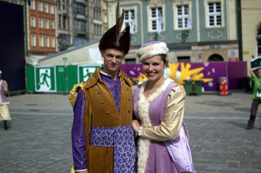 WROCLAW, POLAND - JUNE 15:  Couple in traditional uniform, members of "Jedliniok" folk group visits Euro 2012 fanzone on June 15, 2012 in Wroclaw.  